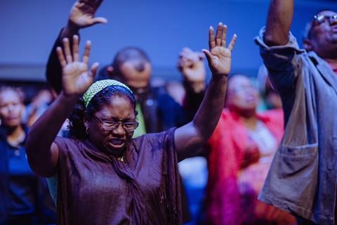Worshippers with hands raised